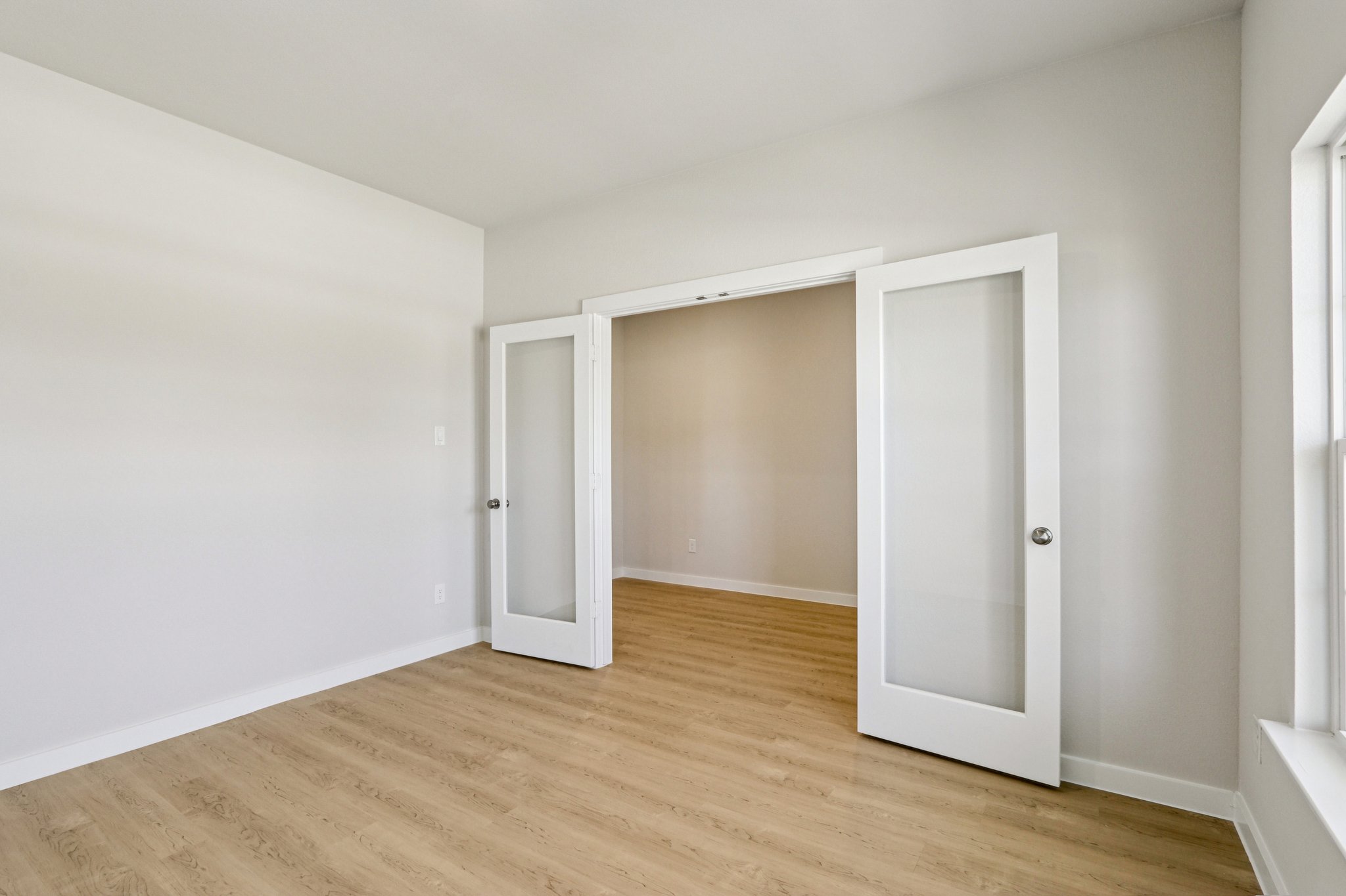 A room with white doors.