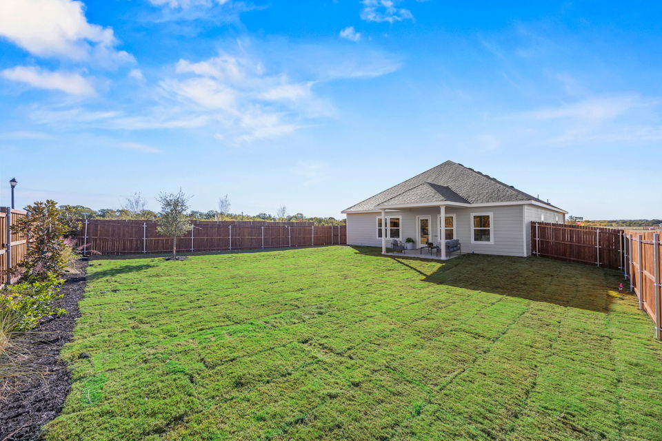 A house with a fence around it.