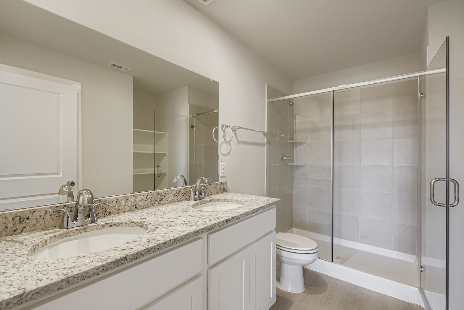 A bathroom with a glass shower.