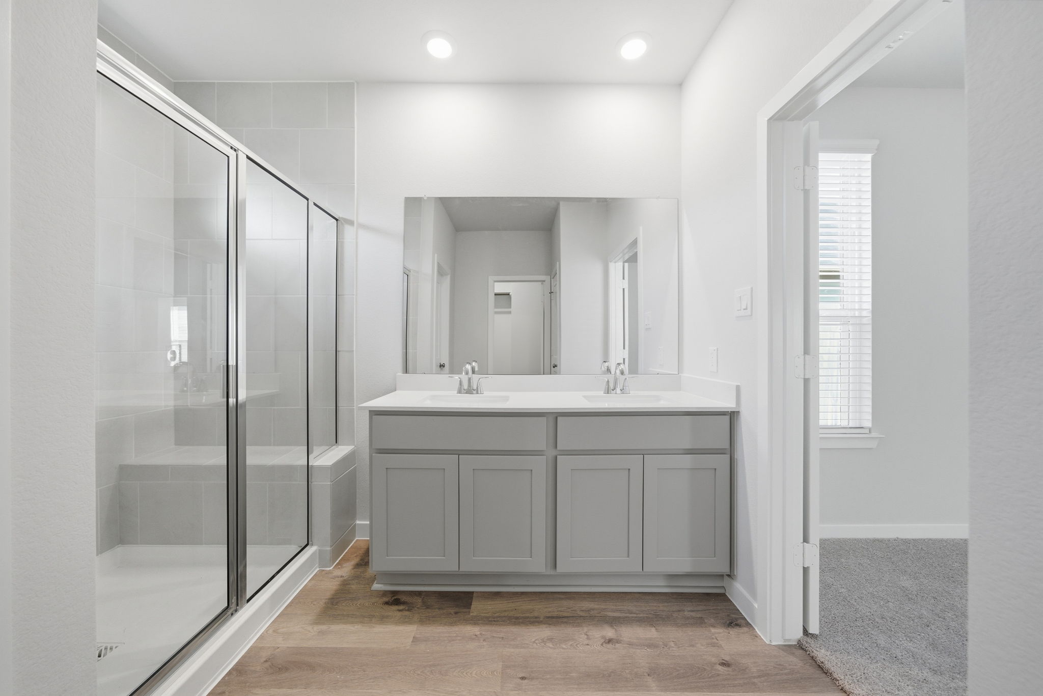 A bathroom with a glass shower.