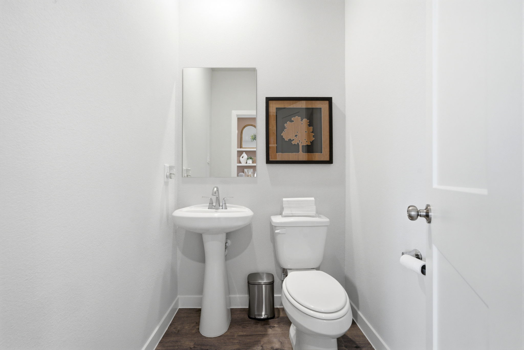 A bathroom with a toilet and sink.