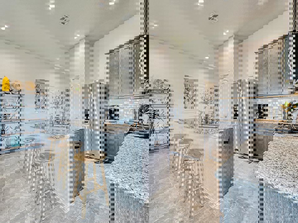 A kitchen with a bar stool.