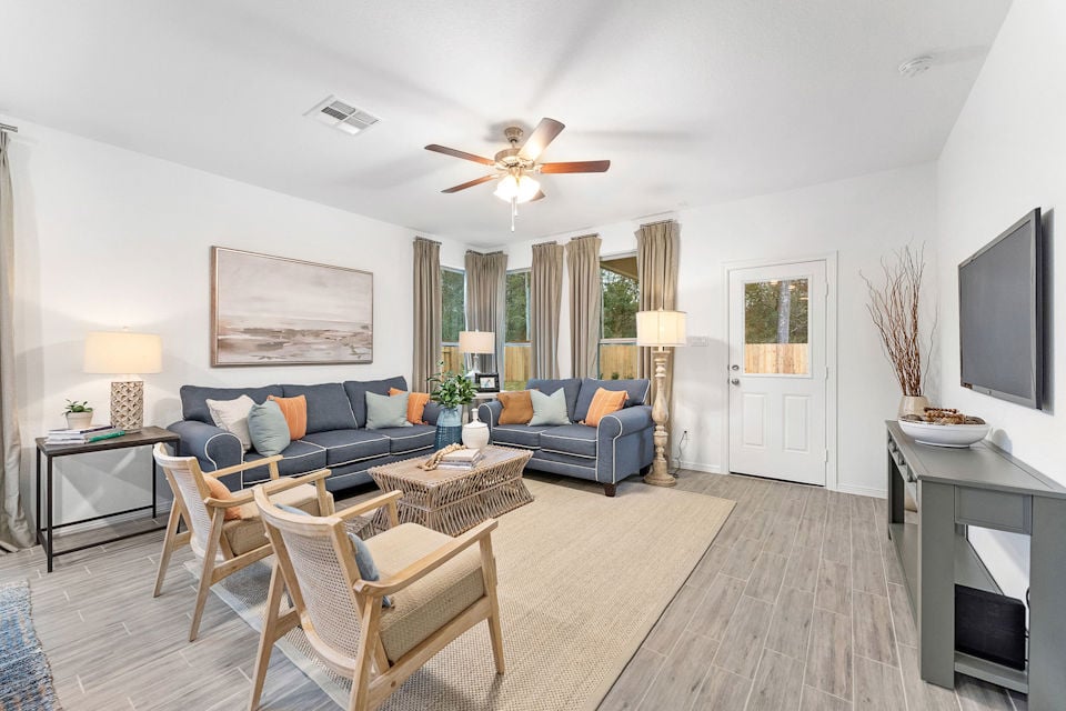 A living room with a wood floor.