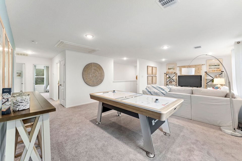 A room with a couch and a table.