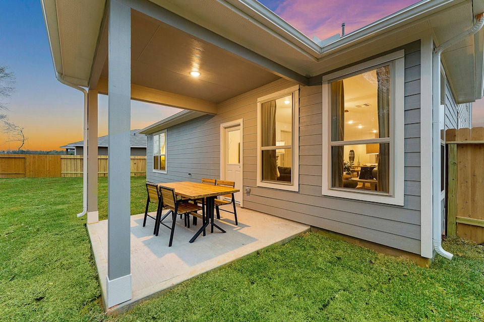 A house with a table and chairs.