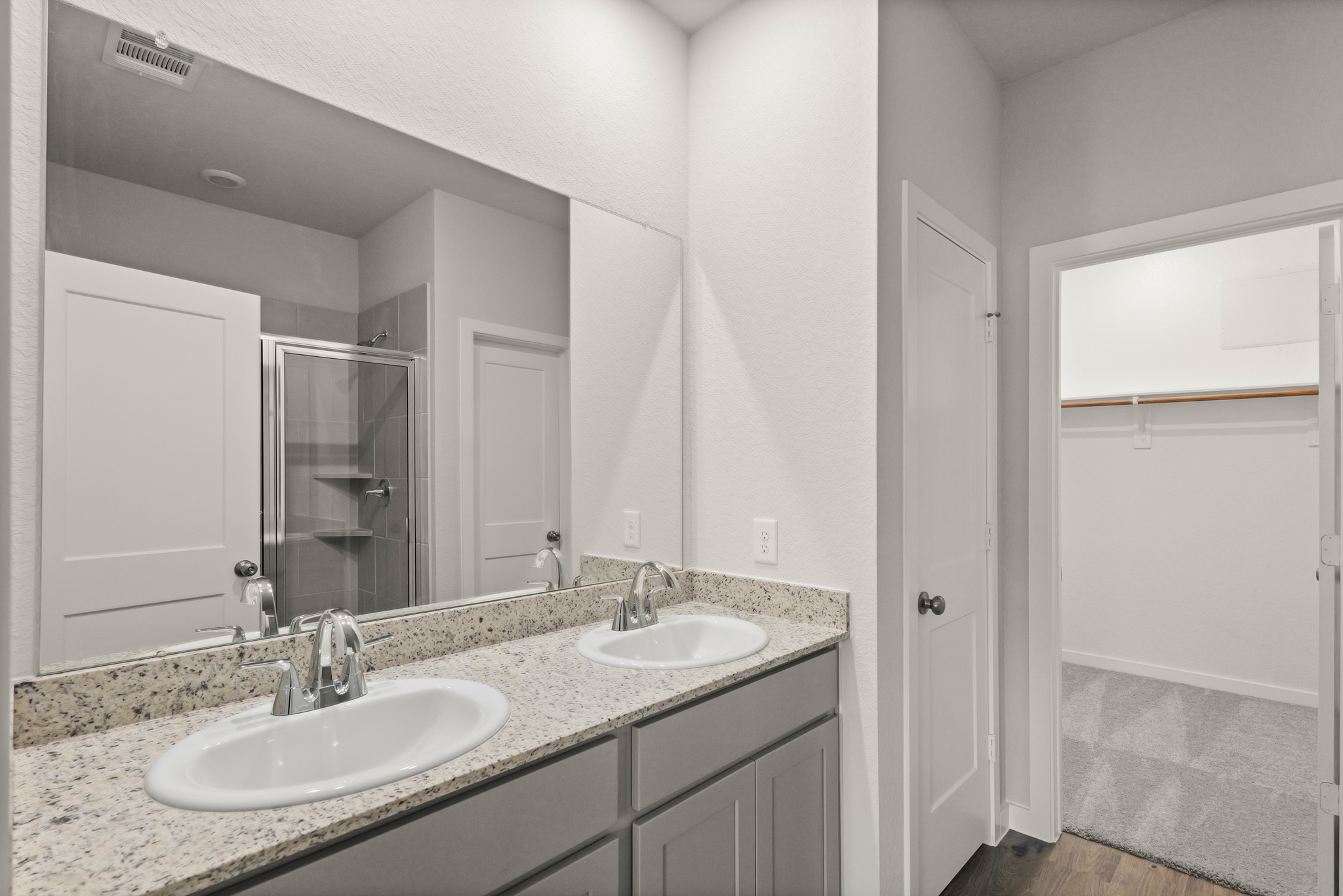 A bathroom with two sinks.