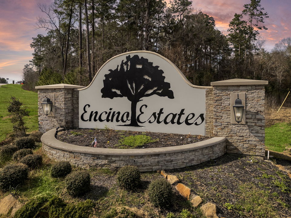 A sign on a stone wall.