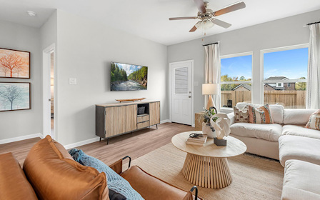 A living room with a large window.
