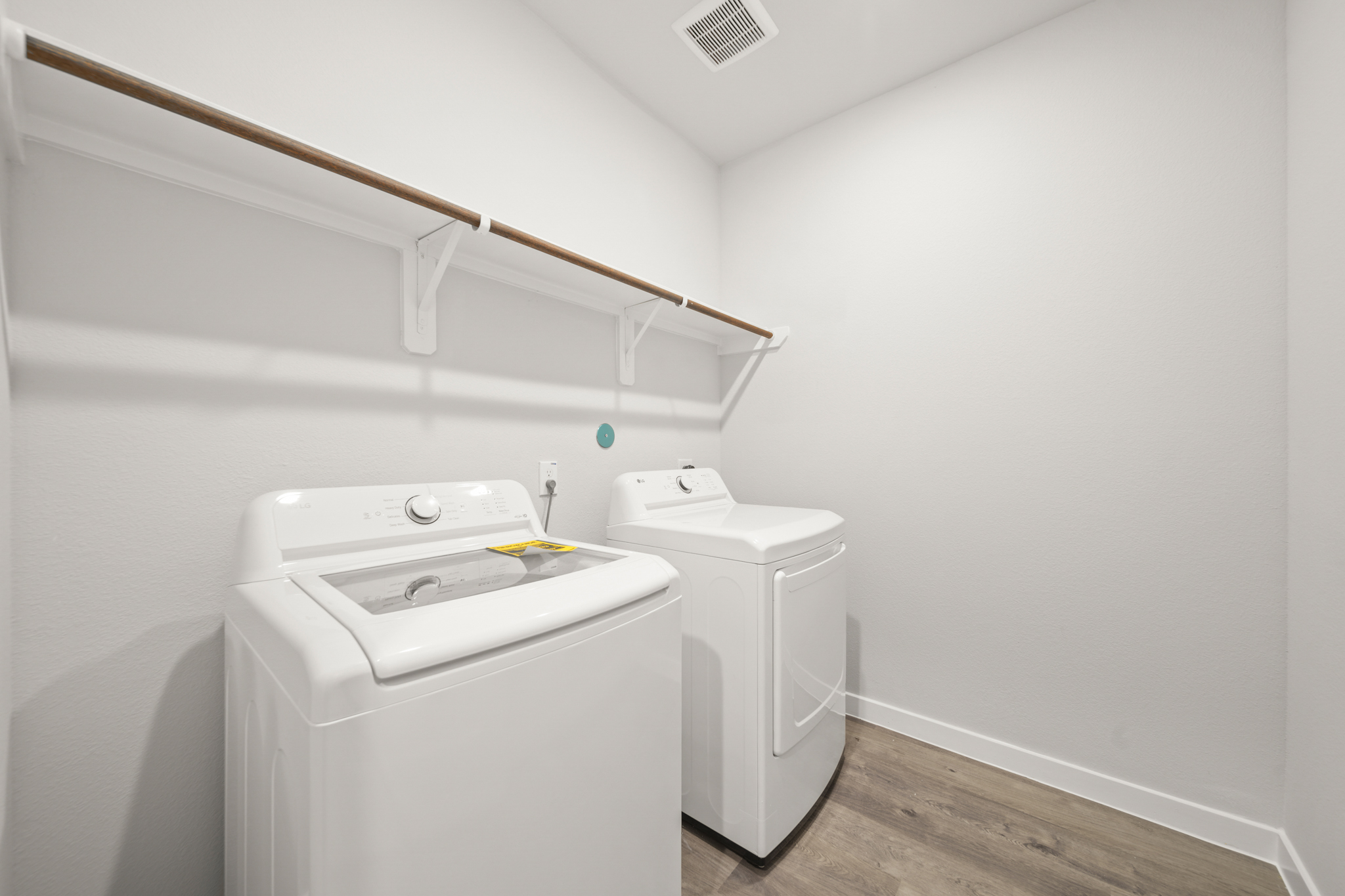 A white washer and dryer in a room.
