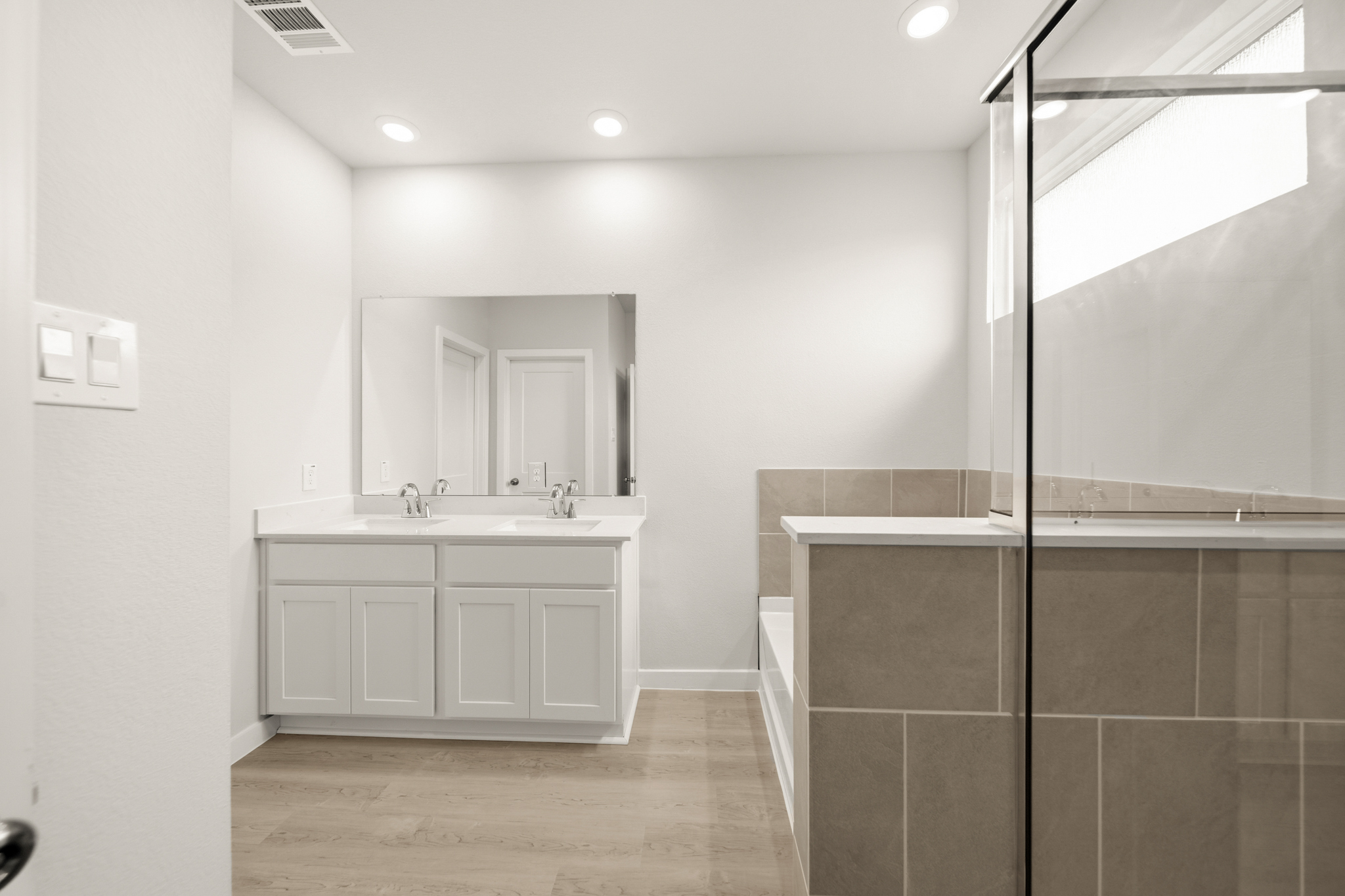 A bathroom with a glass shower.