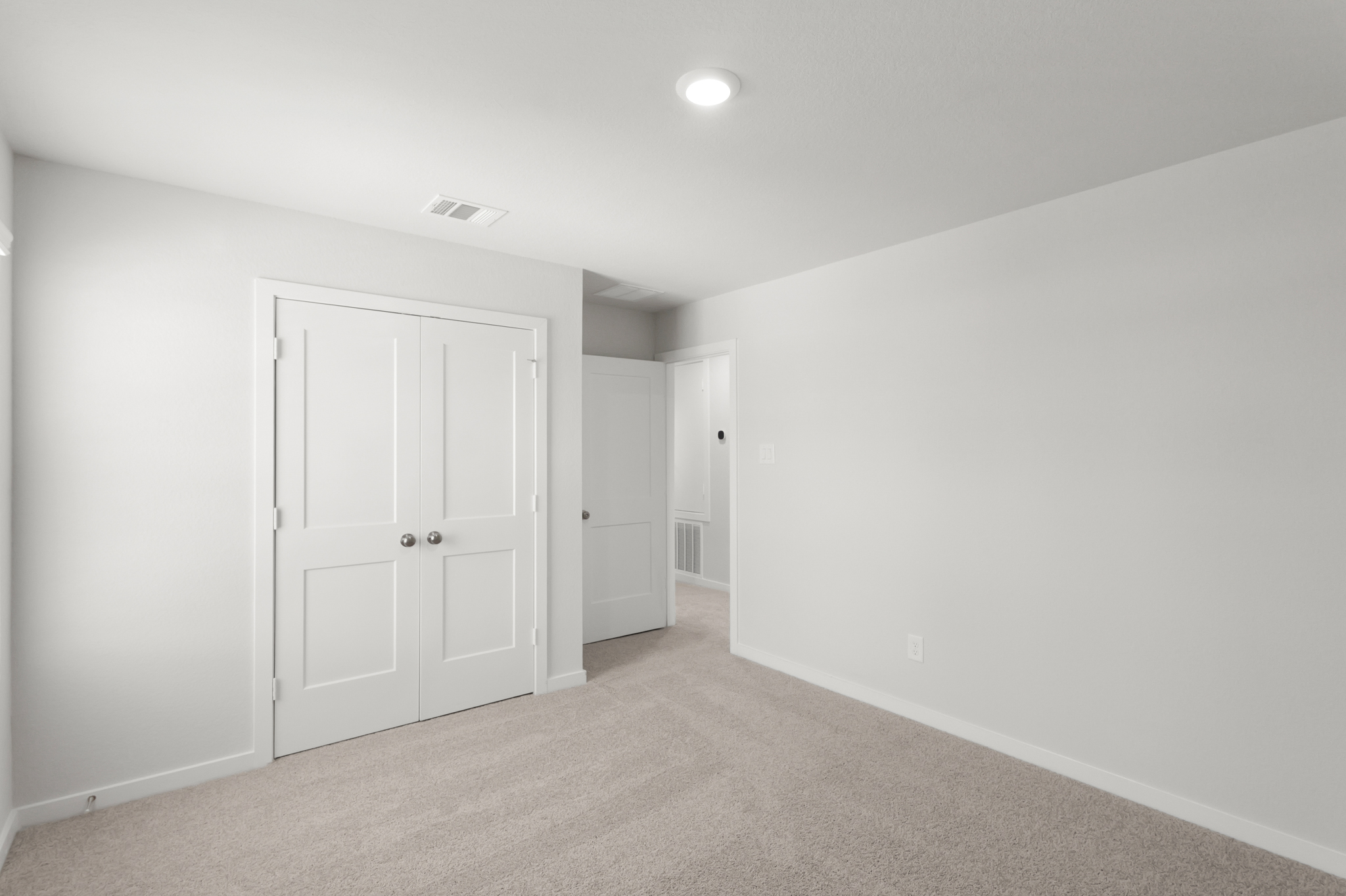 A room with white doors.