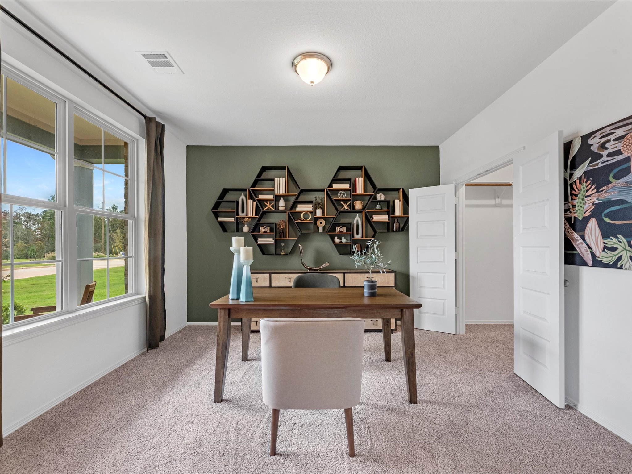 A room with a table and chairs.