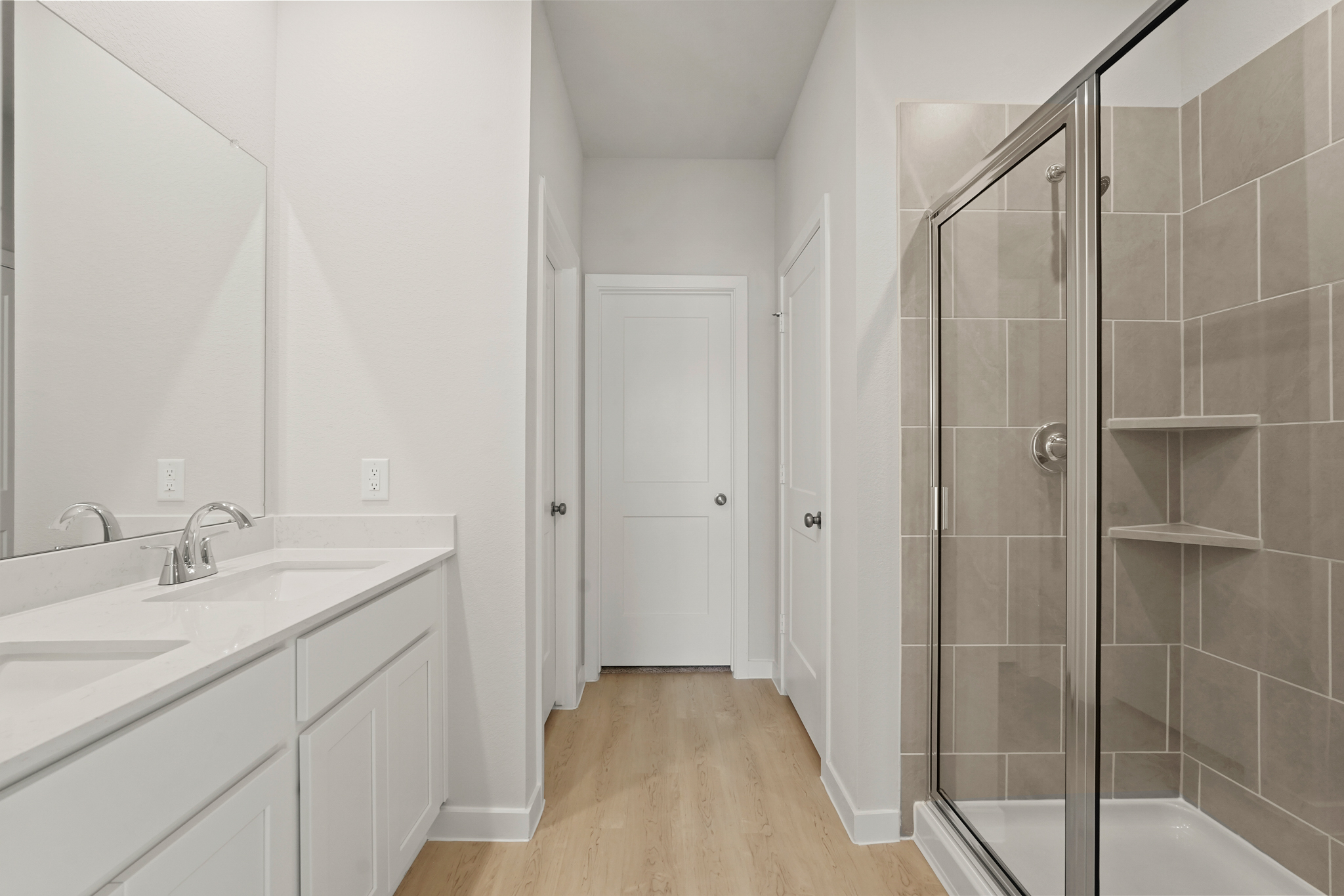 A bathroom with a glass shower.