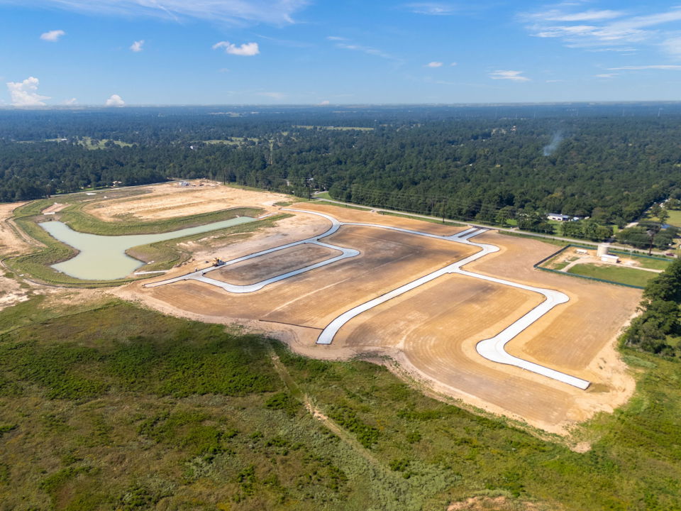 A landscape with a road and trees.