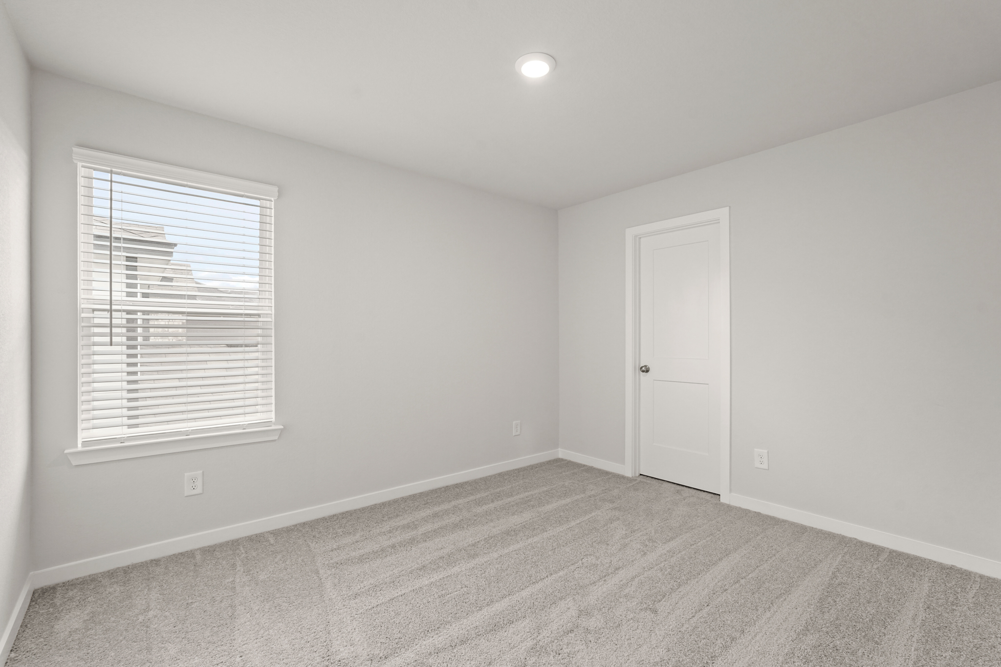 A room with a door and a window.