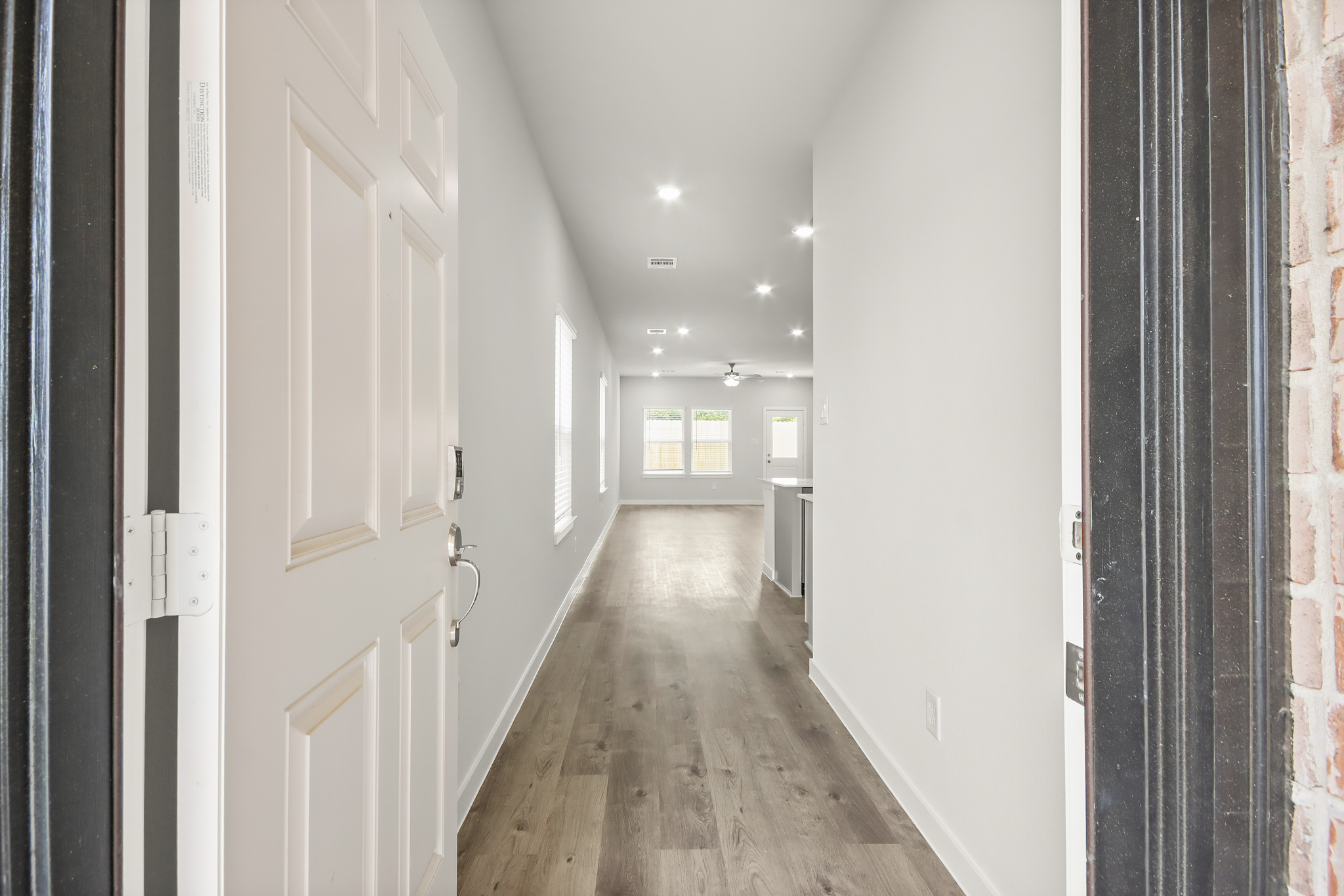 A hallway with white doors.