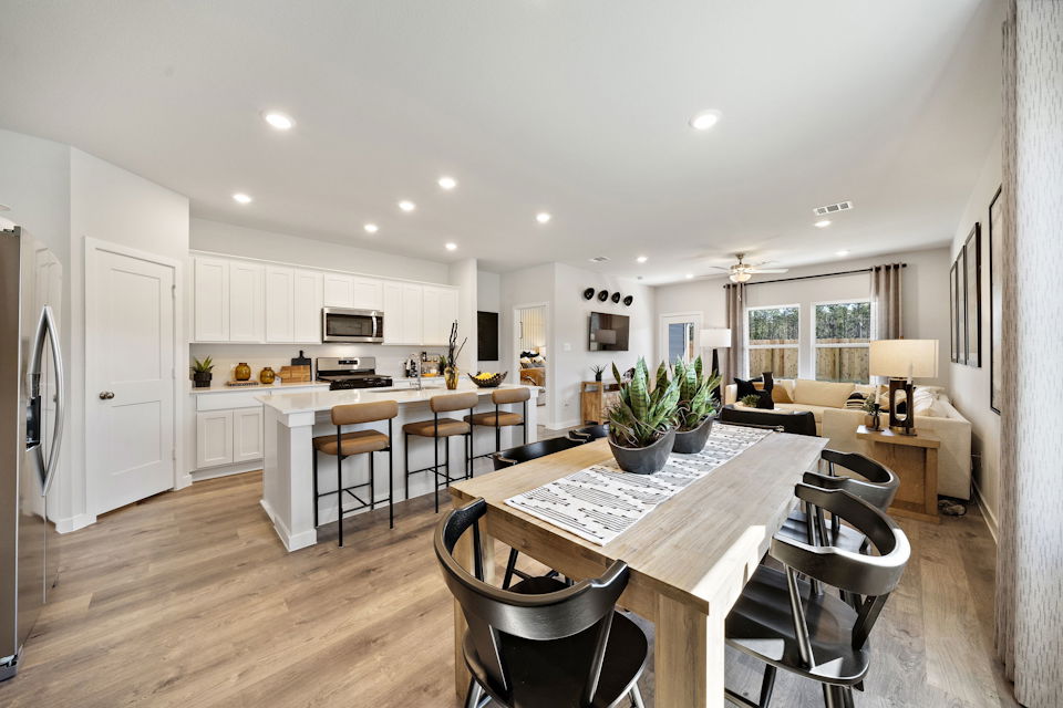 A kitchen with a dining table.