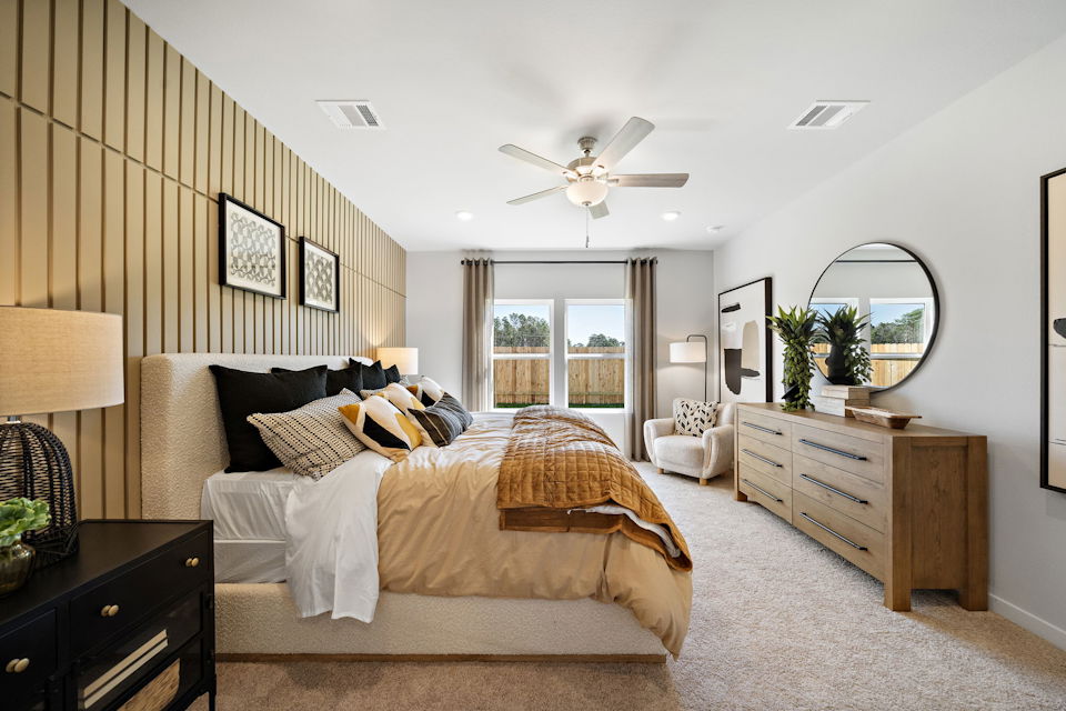 A bedroom with a large bed.