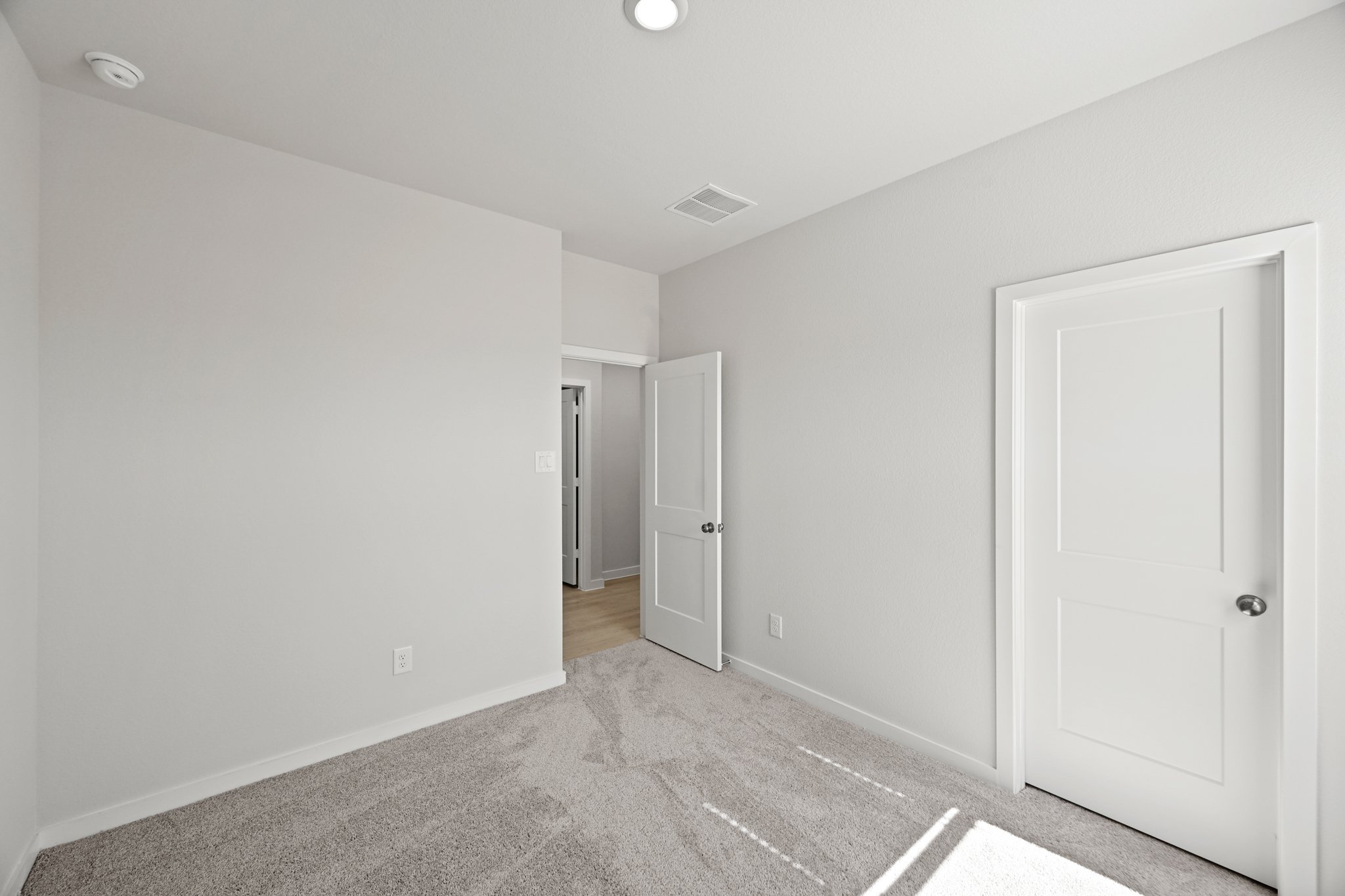 A room with white doors.