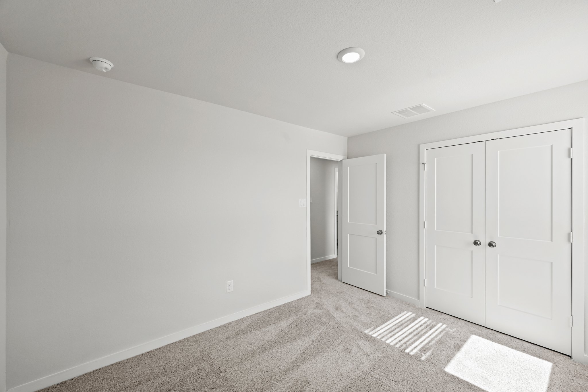 A room with white doors.