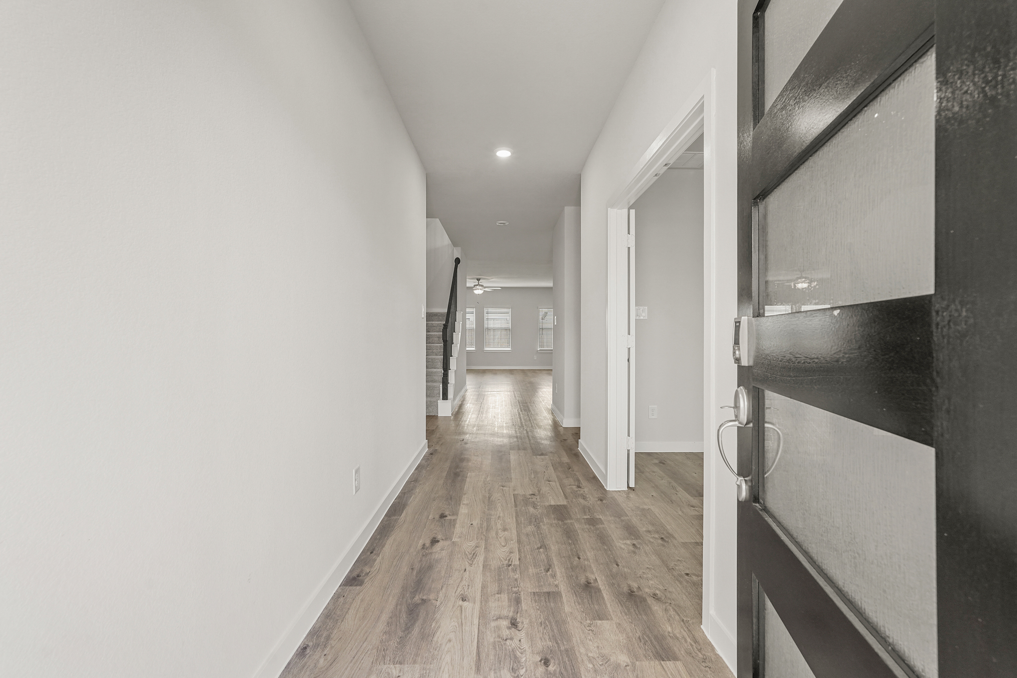 A hallway with white walls.