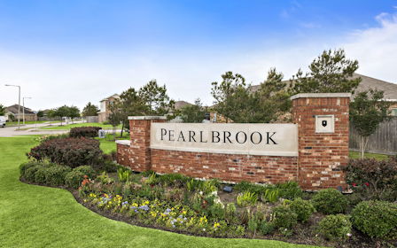 A sign on a brick wall.