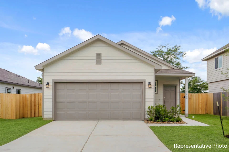 A house with a garage with American Gothic House in the background.