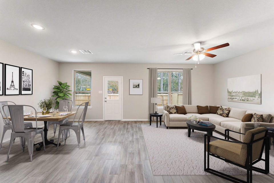 A living room with a chandelier and a couch.