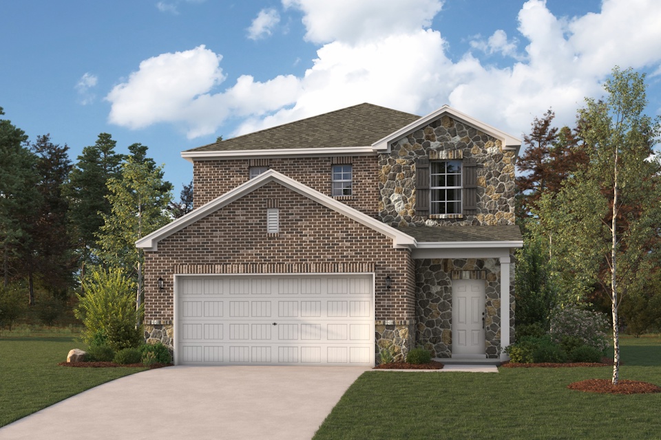 A house with a garage and trees.