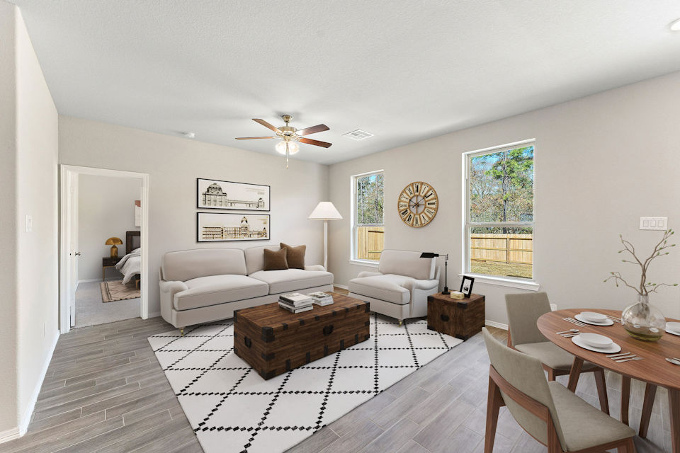 A living room with a couch and a table.