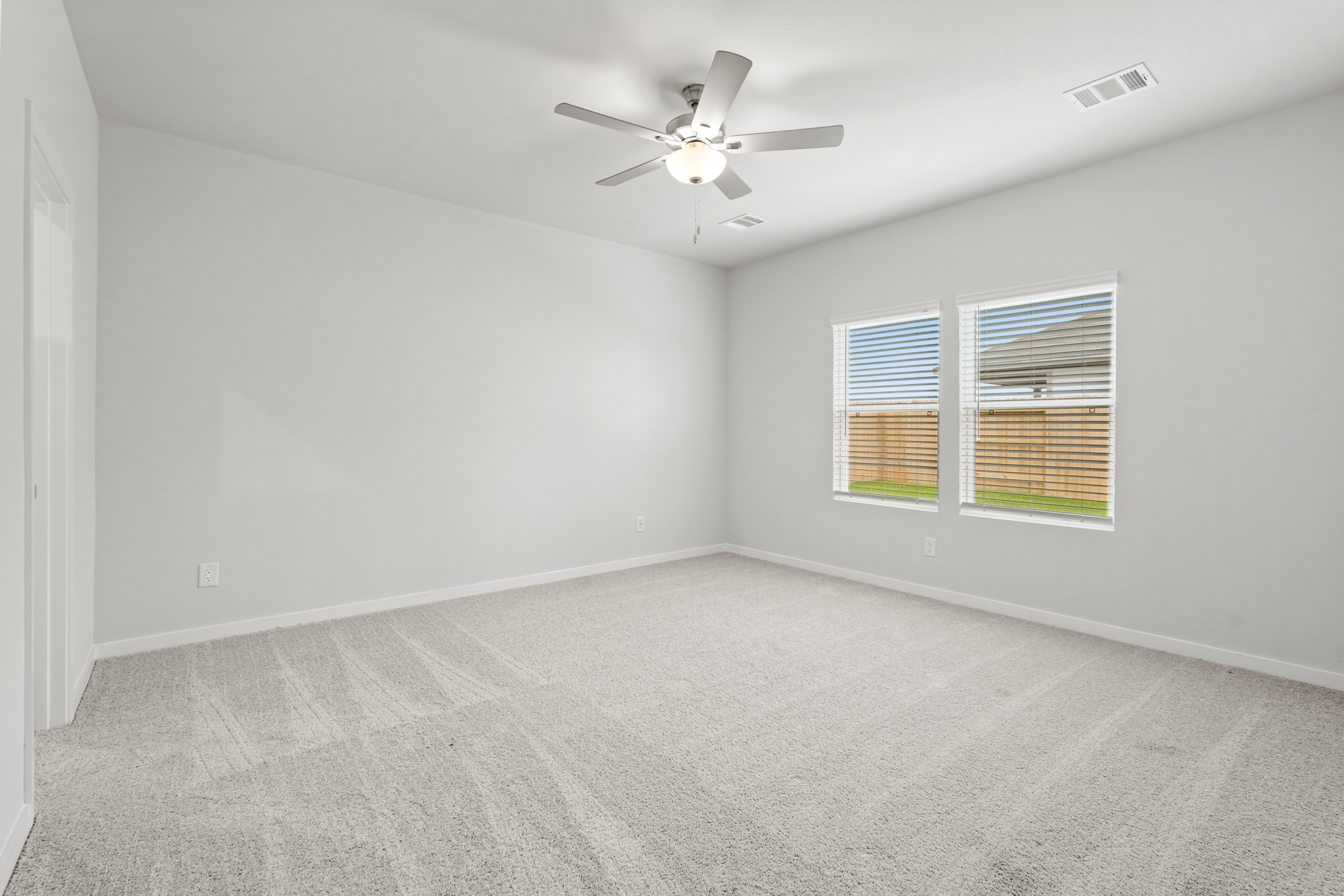 A ceiling fan in a room.