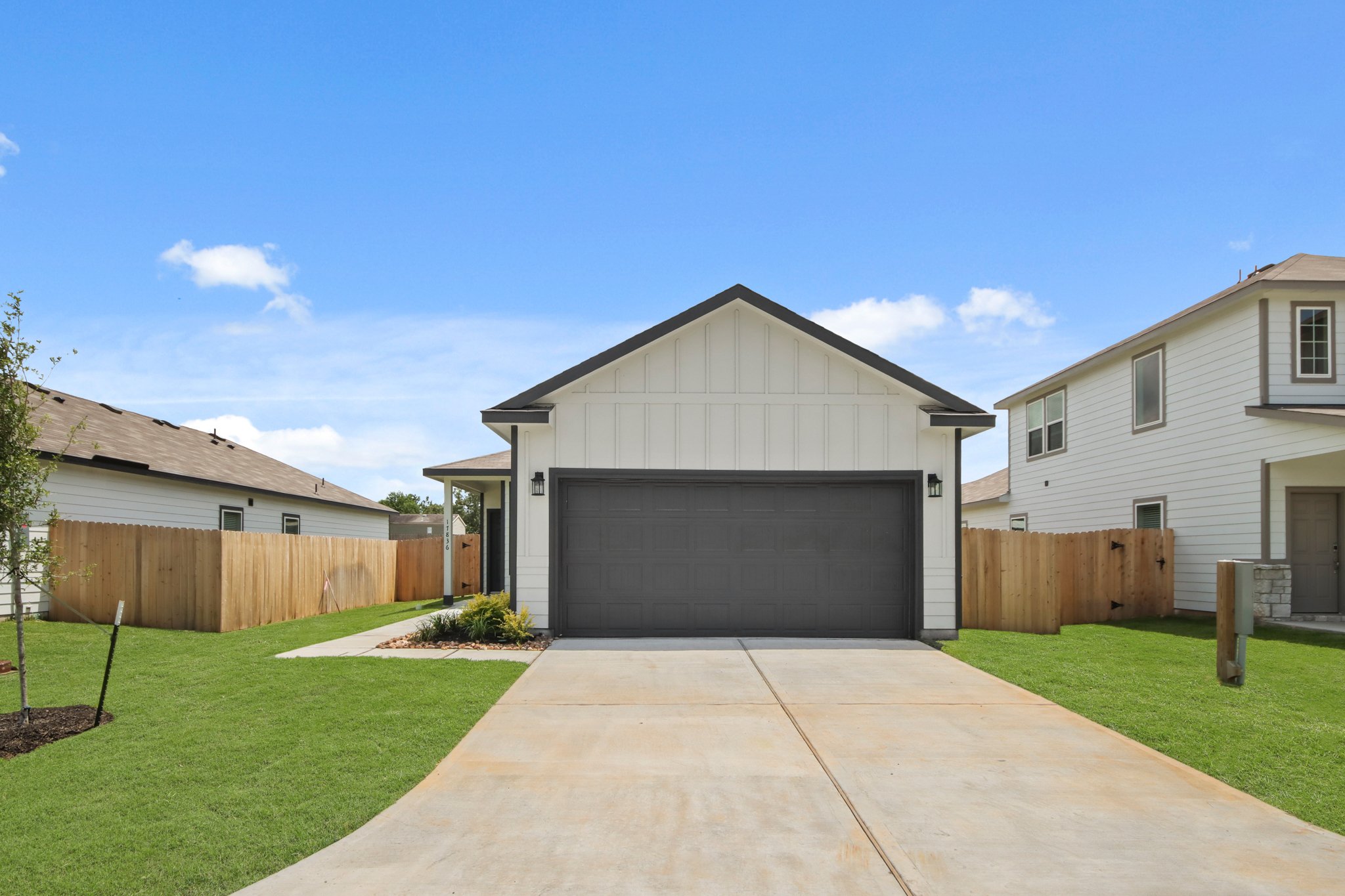 A driveway leading to a house.