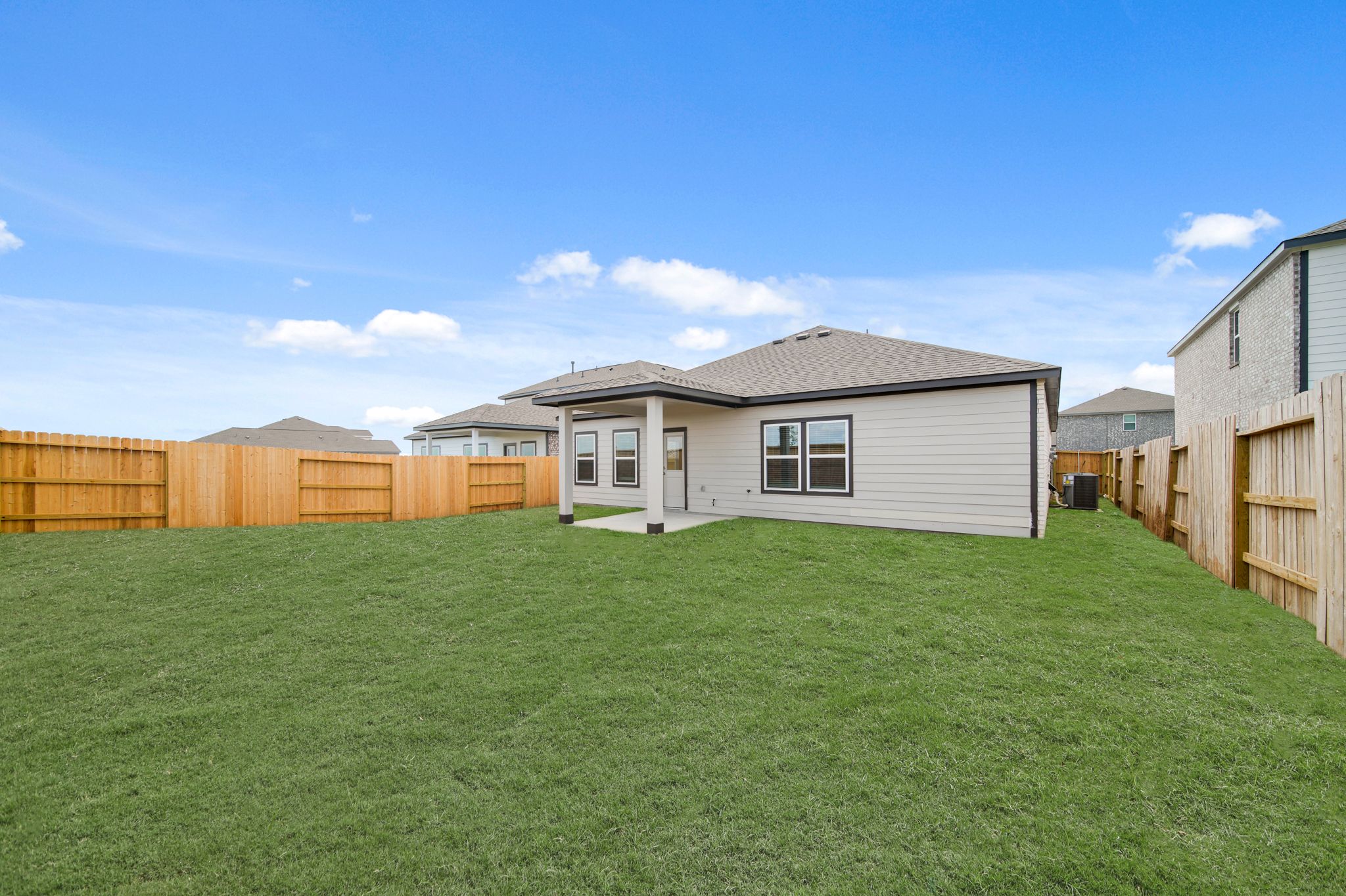 A house with a green lawn.