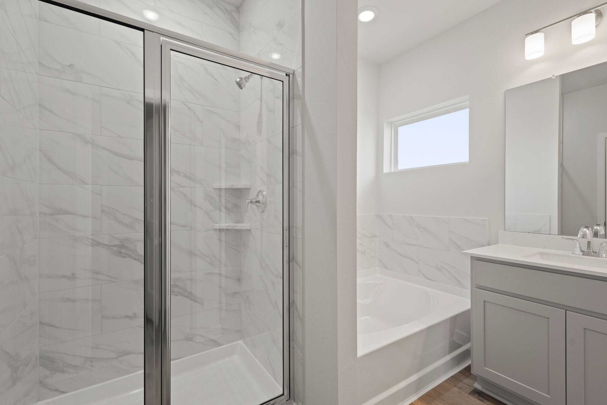 A bathroom with a glass shower.