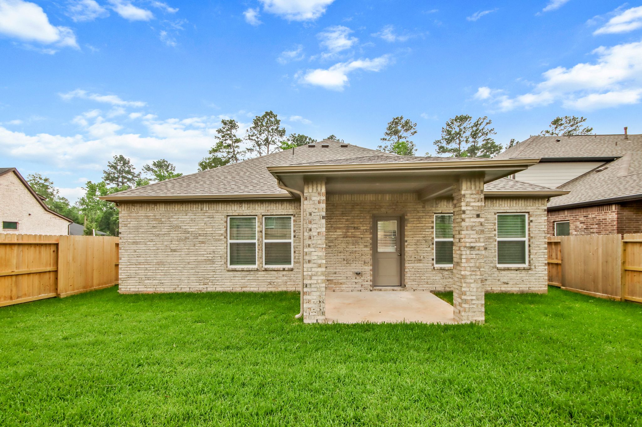 A house with a grass yard.