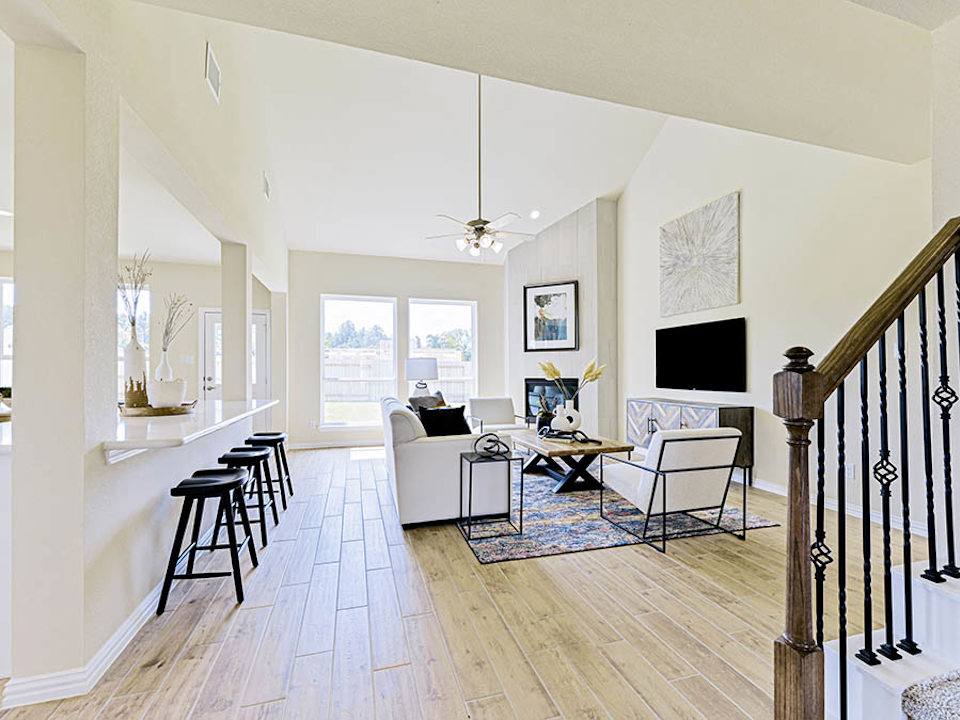 A living room with a wood floor.