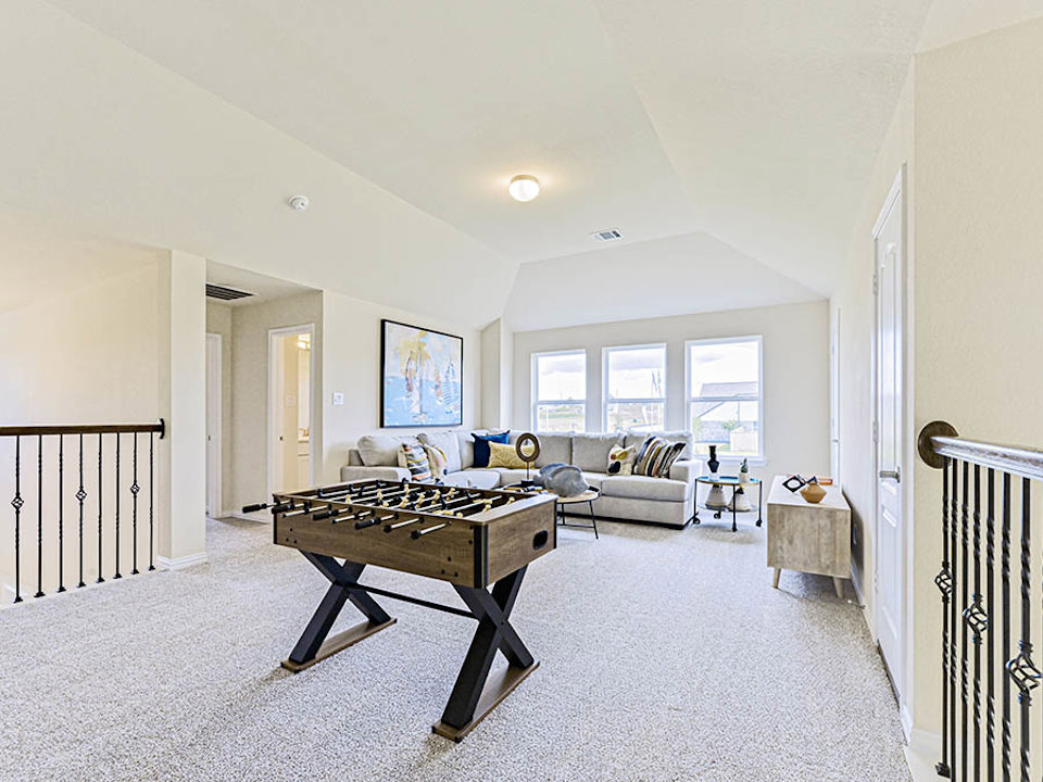 A living room with a couch and a table.