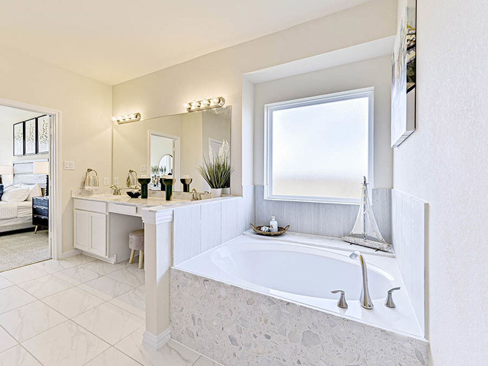 A bathroom with a tub and sink.