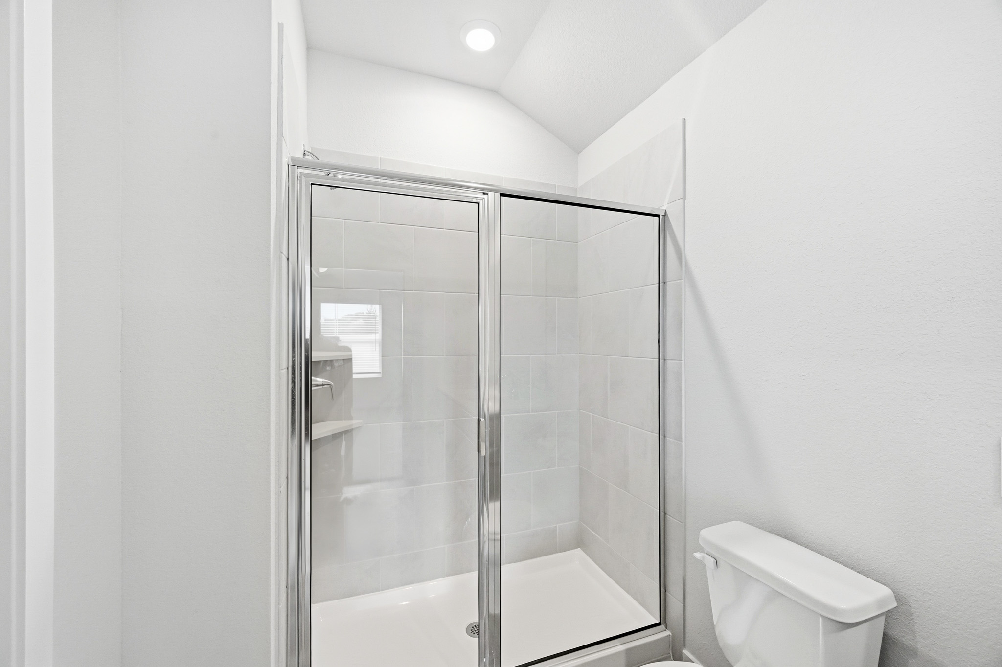 A bathroom with a glass shower.
