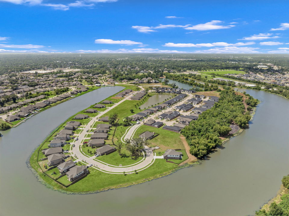 A river with a city in the background.