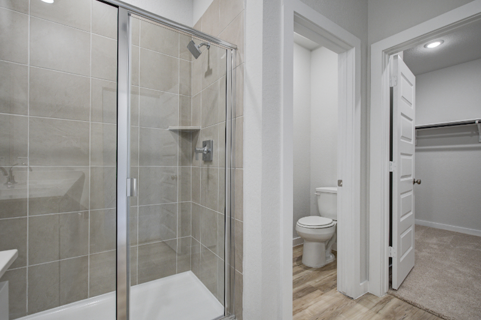 A bathroom with a glass shower.