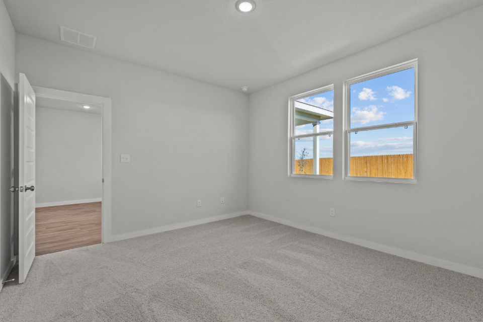A room with a window and a door.