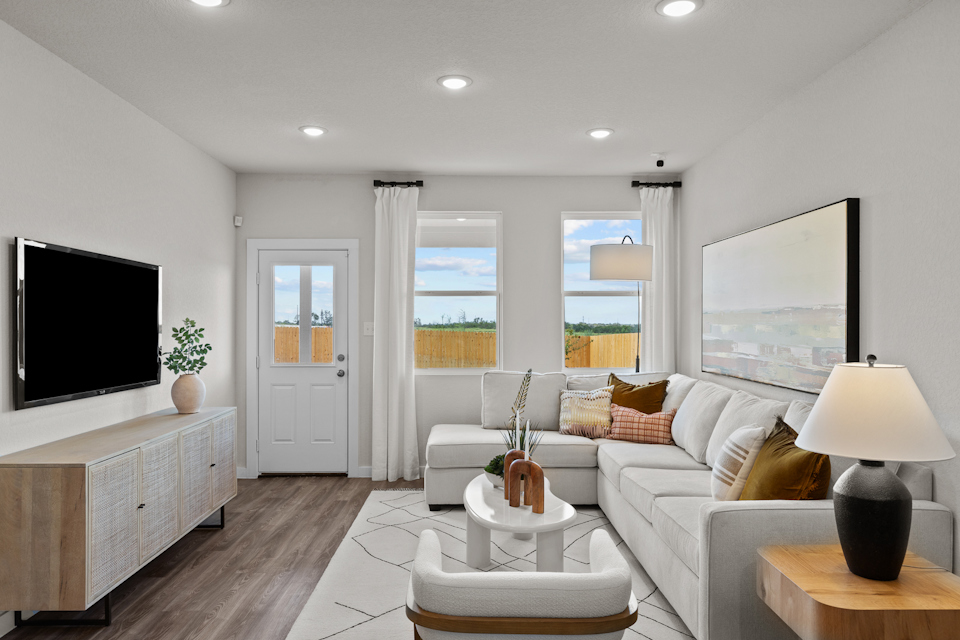 A living room with a tv and a couch.