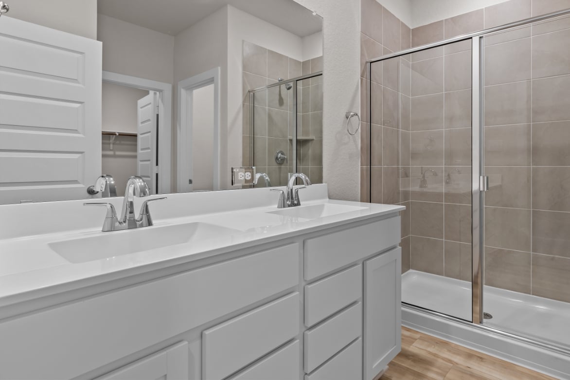 A bathroom with a glass shower.