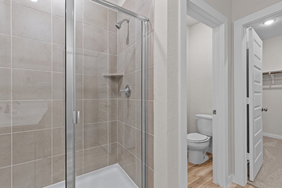 A bathroom with a glass shower.