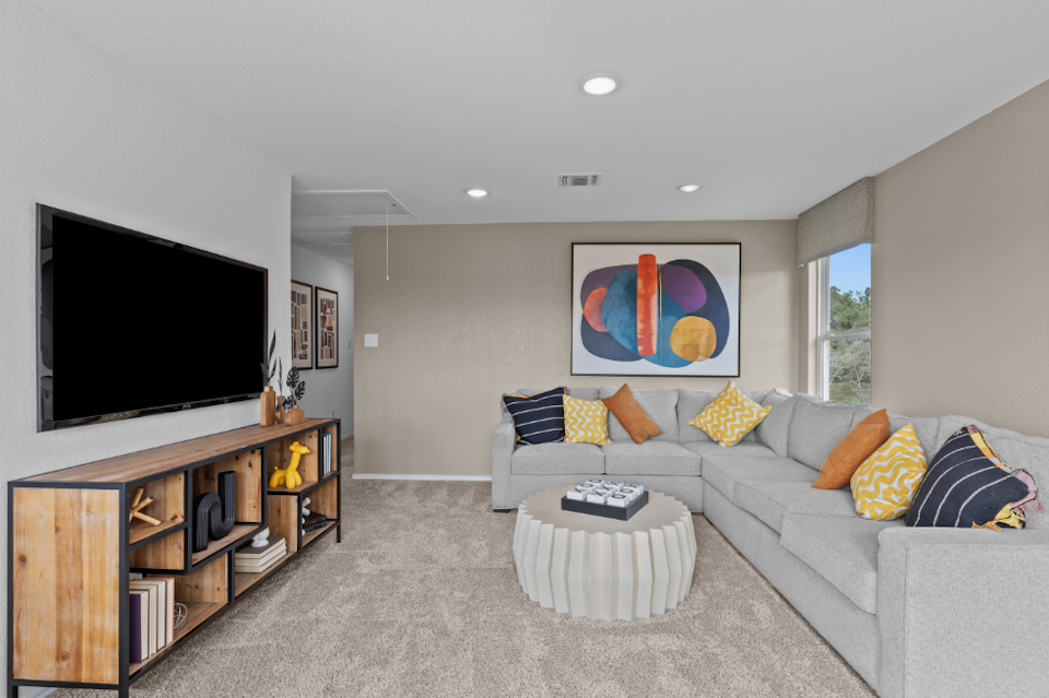 A living room with a tv and couches.
