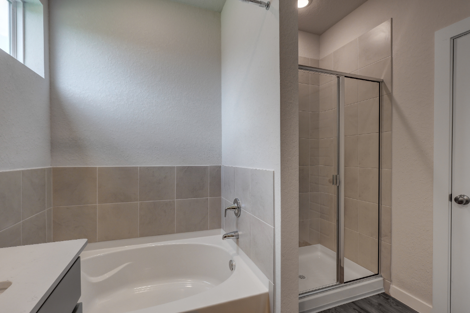 A bathroom with a glass shower.