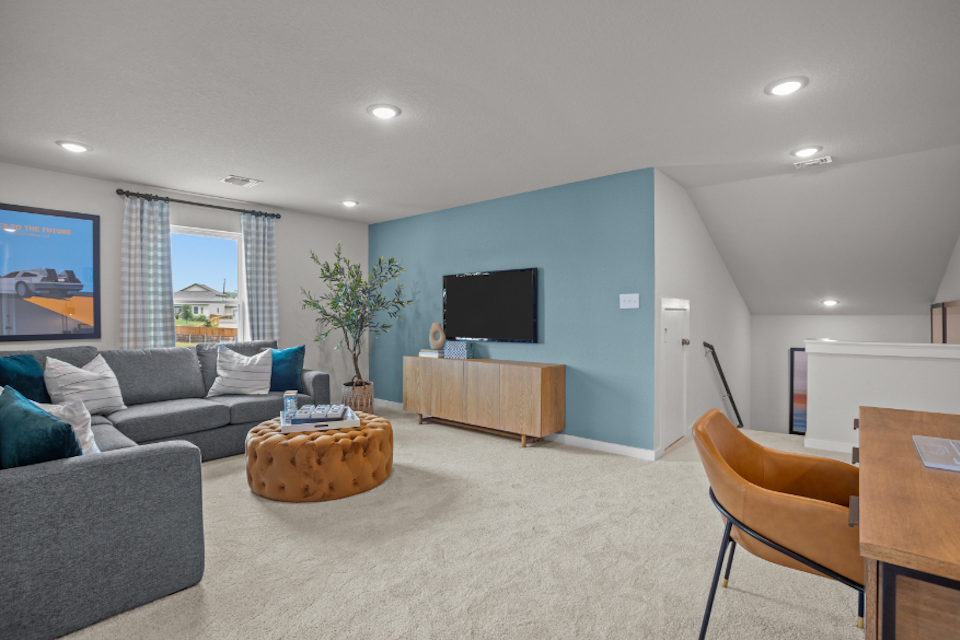 A living room with a tv and couches.