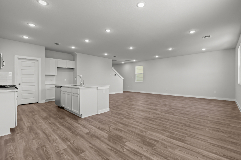 A large kitchen with white cabinets.