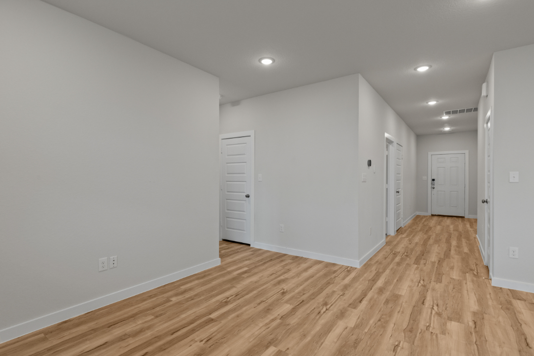 A room with white cabinets.